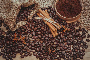 A cup of latte coffee and coffee beans. Toning.