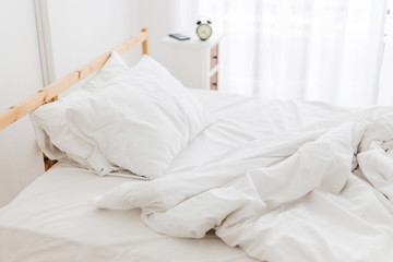 Fototapeta na wymiar white bed blanket morning time lazy Sunday concept
