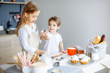 Obraz na płótnie Canvas Kids Cooking Baking Cookies Kitchen Concept.