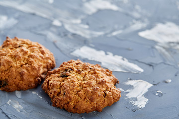 Sweet cookies arranged in pattern on light textured background, close-up, shallow depth of field, selective focus.