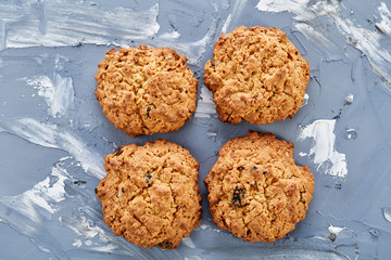 Sweet cookies arranged in pattern on light textured background, close-up, shallow depth of field, selective focus.