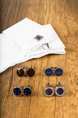 Cufflinks with shirt on the wooden ground