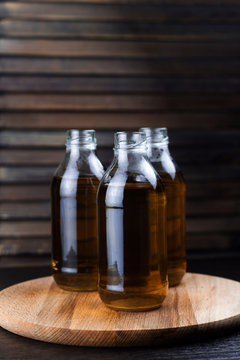 three bottles of fresh drink wooden background