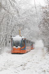 Heavy snowfall in Moscow. Snow-covered roads and damaged power lines during a snowfall. Collapse of public transport and stopped tram