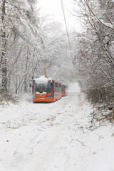 Heavy snowfall in Moscow. Snow-covered roads and damaged power lines during a snowfall. Collapse of public transport and stopped tram