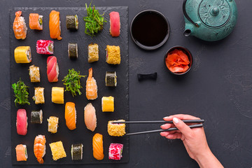 Set of sushi maki and rolls on gray background, top view © Prostock-studio