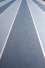 Fototapeta premium Background image of blue lanes on a running circuit