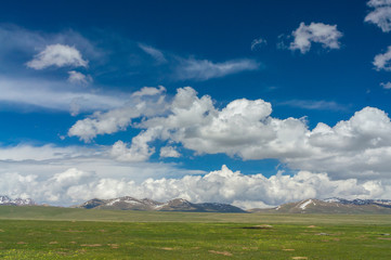 A delightful landscape with grandiose clouds and blue sky