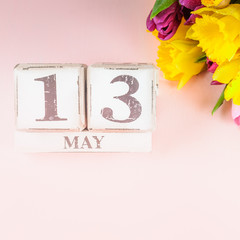 Spring Flowers and Wooden Blocks with Mothers Day Date, 13 May,