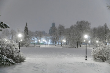 Heavy snowfall in Moscow. Night view of parks and avenues during a snowfall. Collapse of public services