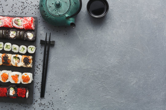 Top view set of sushi maki and rolls on grey table