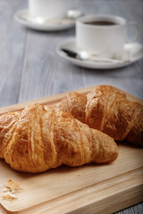Black coffee and croissants.