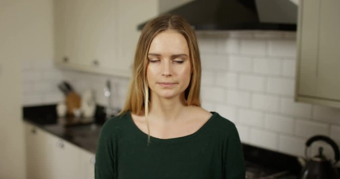 4K Young woman fidgeting & rolling her eyes, listening to very boring video call
