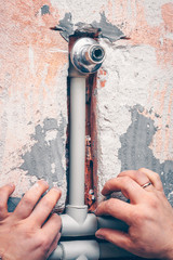 The plumber works in plumbing, works with plastic pipes