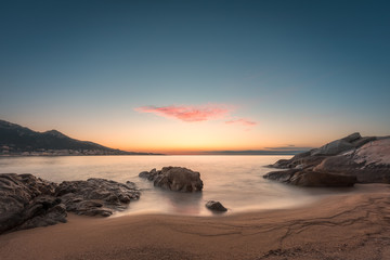 Sunset on sandy Algajola beach in Corsica