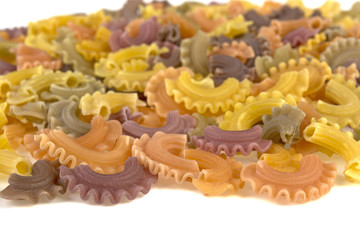 multicolored pasta on white background