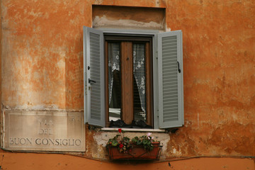 Fototapeta premium wooden window with flowers florence italy