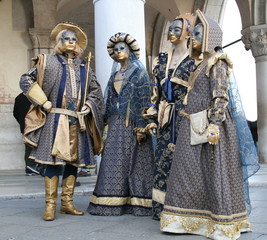 people in beautiful masquerade costume at the Venice carnival Italy
