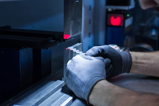 operator working cut and bending metal sheet