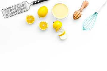 home kitchen table with yellow lemons for cooking citrus curd white background top view mock-up