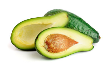 avocado and half isolated on white background close-up