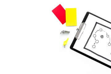 Sport judging concept. Referee. Tactic plan for game, red and yellow cards, whistle on white background top view copy space