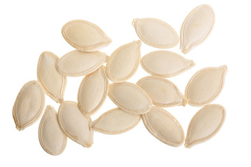 Heap of pumpkin seeds isolated on white background. Top view. Flat lay