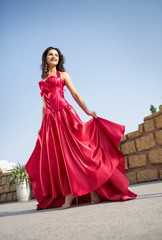 Fototapeta premium Beautiful woman in a red dress