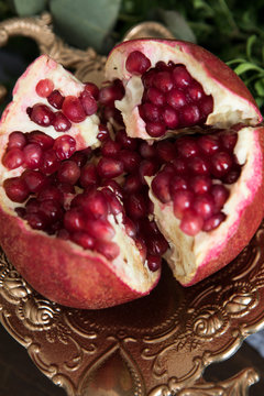 Pomegranate divided in four parts insude view close-up