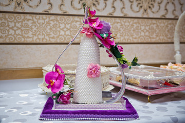 Decorative sweets for engagement . Sugar for the engagement . Violet and pink flower .