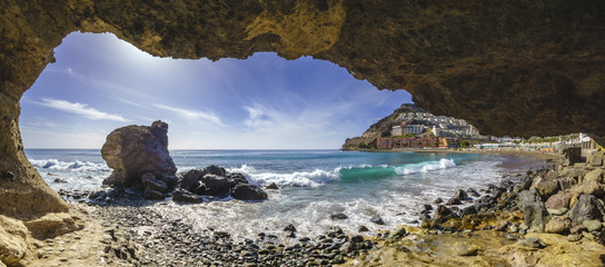 grotto on the beach on Playa del Cura, near playa Amadores ,Puerto Rico town, Gran Canaria, Canary Islands. Spain - obrazy, fototapety, plakaty