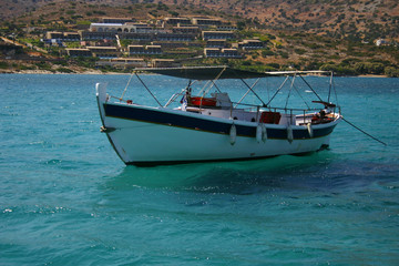 fishing boat at the blue Mediterranean sea water