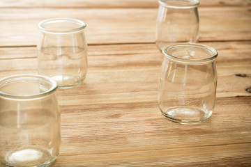 Empty glass jar on a wooden table