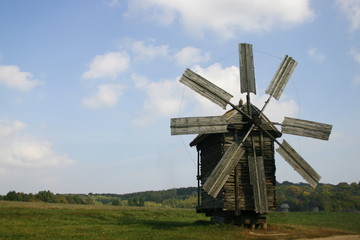 old wood windmill in the field