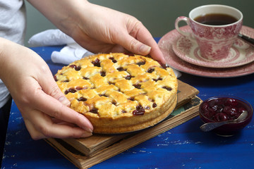 A traditional American or European cherry pie made of shortcake. Rustic style.