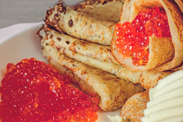 Delicious pancakes with caviar, salmon.