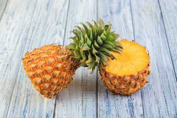two halves of pineapple, cuted ripe pineapple