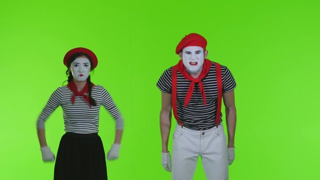 Evil mimes swear on a green background