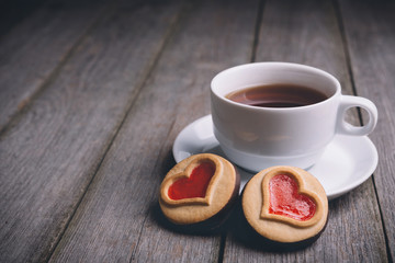 cookies in the shape of a heart with tea