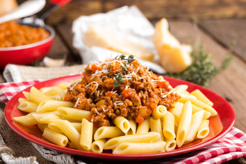 Spaghetti bolognese. Spaghetti served with a sauce of ground beef meat, tomato, onion, carrot and thyme. Traditional italian cuisine