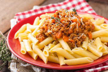 Spaghetti bolognese. Spaghetti served with a sauce of ground beef meat, tomato, onion, carrot and thyme. Traditional italian cuisine