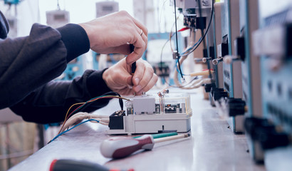 Electrician worker checking electricity meters. Electrical equipment.