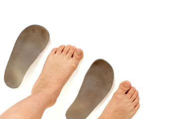 Top view of orthopedic insoles for shoes and kids legs