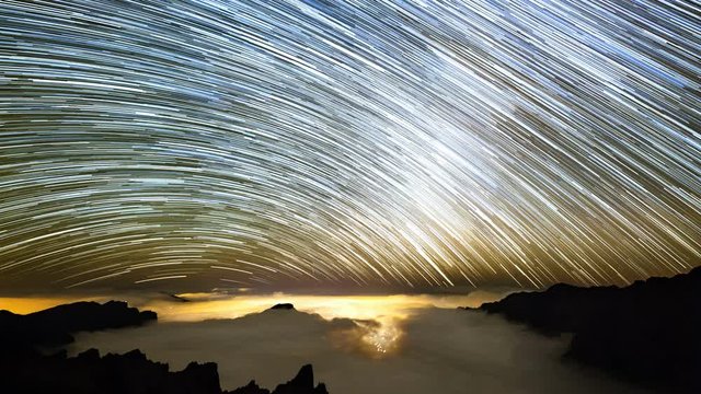 Timelapse sequence of the milky way above the Caldera de Taburiente in La Palma, Spain in 4K with the stars forming star trails.