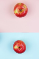 Apple, fruit pop art, red apple on a pink blue background, fruit for breakfast, vitamins, vegetarian food, pastel background, minimalism, designer blank, Asian food, American breakfast