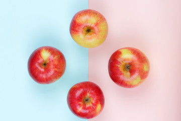 Apple, fruit pop art, red apple on a pink blue background, fruit for breakfast, vitamins, vegetarian food, pastel background, minimalism, designer blank, Asian food, American breakfast