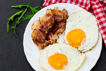 English breakfast - fried egg and bacon. Top view