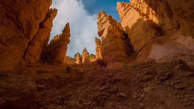 Panoramic view at the cliffs. Spectacular ravine. Tourists walking along the trail. Nature video. Amazing mountain landscape.Bryce Canyon National Park. Utah. USA. 4K, 3840*2160, high bit rate, UHD