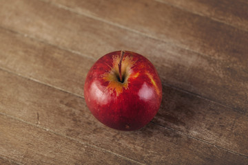 Red fresh apple on wooden background