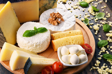 Different sorts of cheese on kitchen table